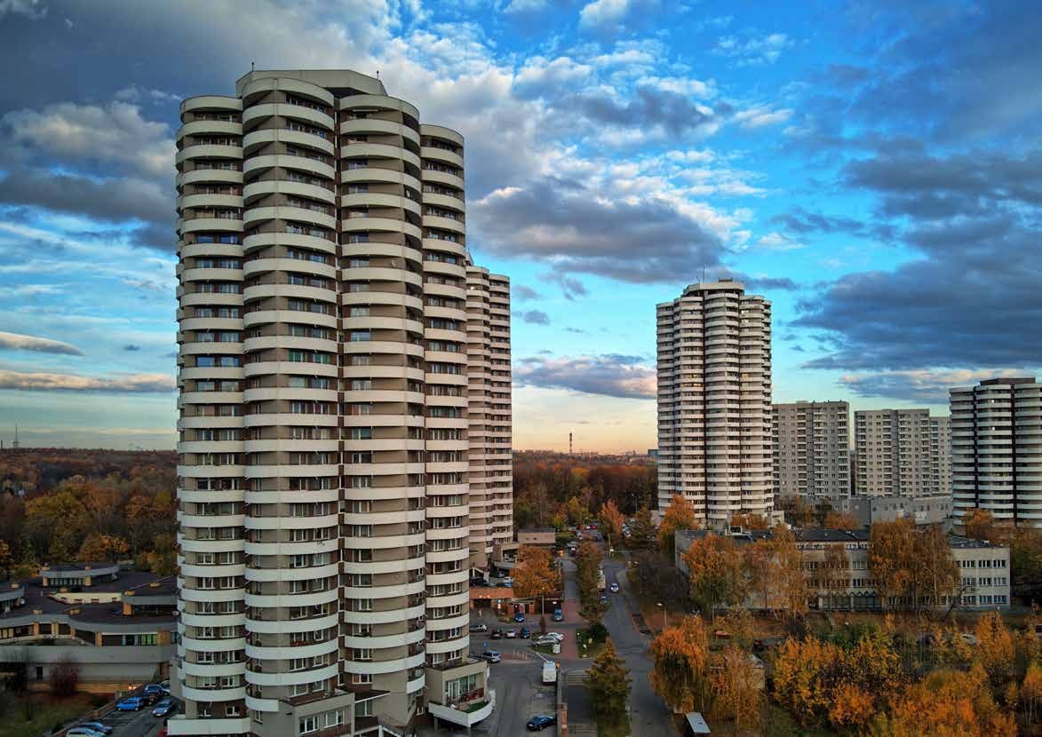 Modern residential buildings among trees